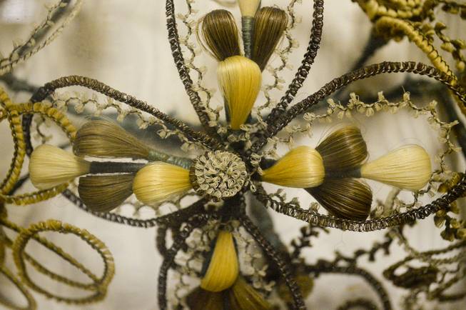 A closeup of a "hair wreath" in the Lyon County Museum in Yerington, Wednesday, Oct. 23, 2013. Making art of human hair was a Victorian era custom for mouring. The hair of deceased loved ones was taken and woven into wreaths. This one by Margaret Nichol was completed in 1860. It was loaned to the museum by area native Elouise Kettenburg.
